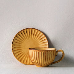 Artisan Stoneware Cup & Saucer – Vintage Sunburst Design