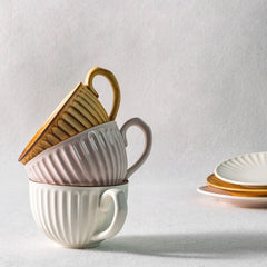 Artisan Stoneware Cup & Saucer – Vintage Sunburst Design