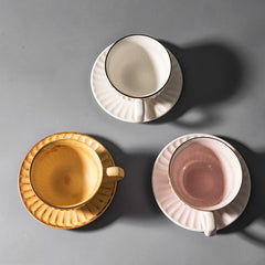 Artisan Stoneware Cup & Saucer – Vintage Sunburst Design